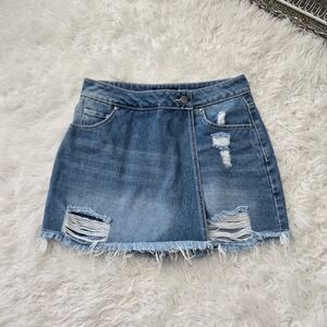 Versona Stylish distressed denim mini skort with frayed hem. Size 4. Perfect for